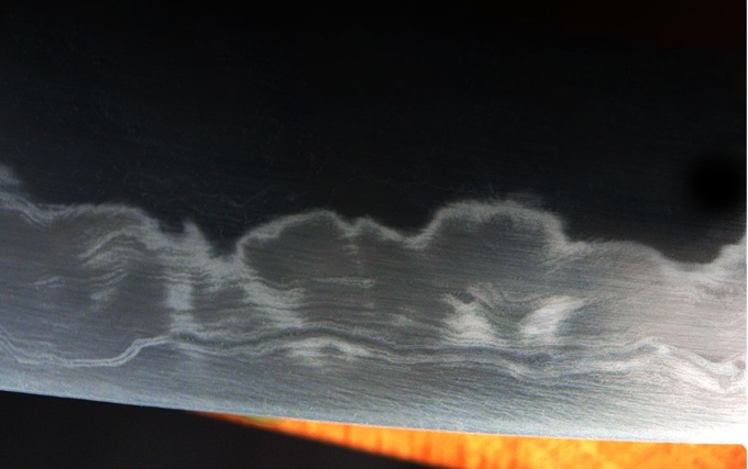 Close view of the hamon temper line on a hand-forged blade